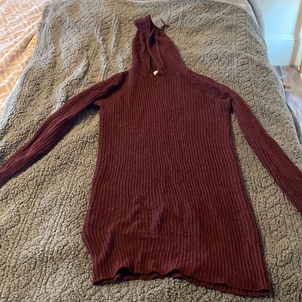 Large, knitted sweater.
